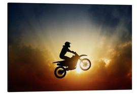 Alubild  Biker springt bei Sonnenuntergang